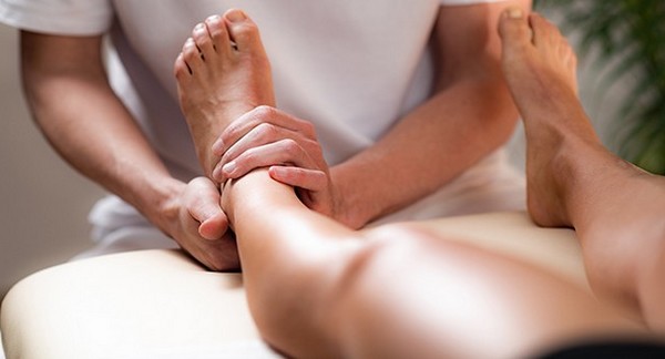 performing foot reflexology